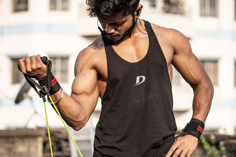 Fitness enthusiast stretching in studio